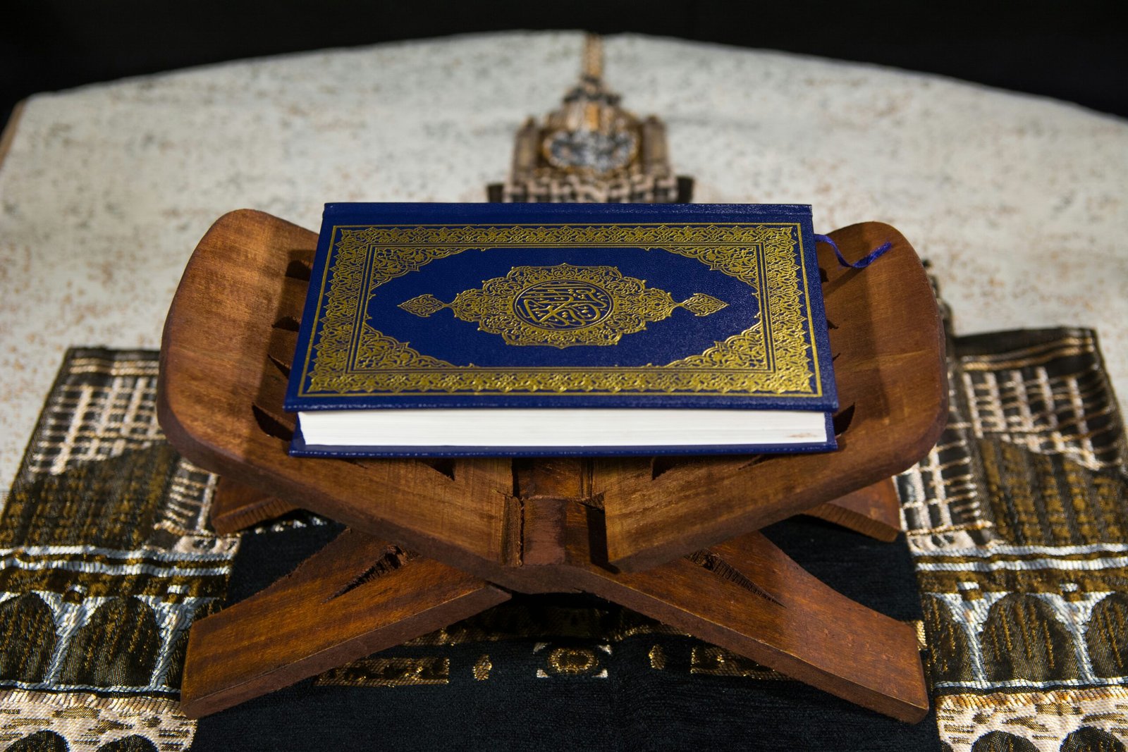 blue and white book on brown wooden table